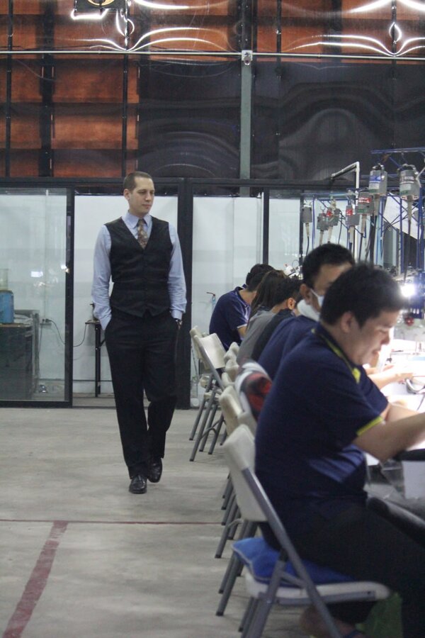 Noah Severs walking through a jewelry manufacturing facility